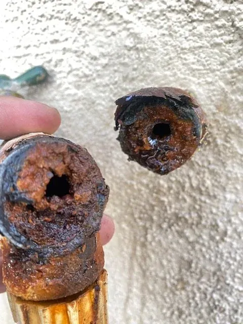 Corrosion inside removed copper water pipe ends