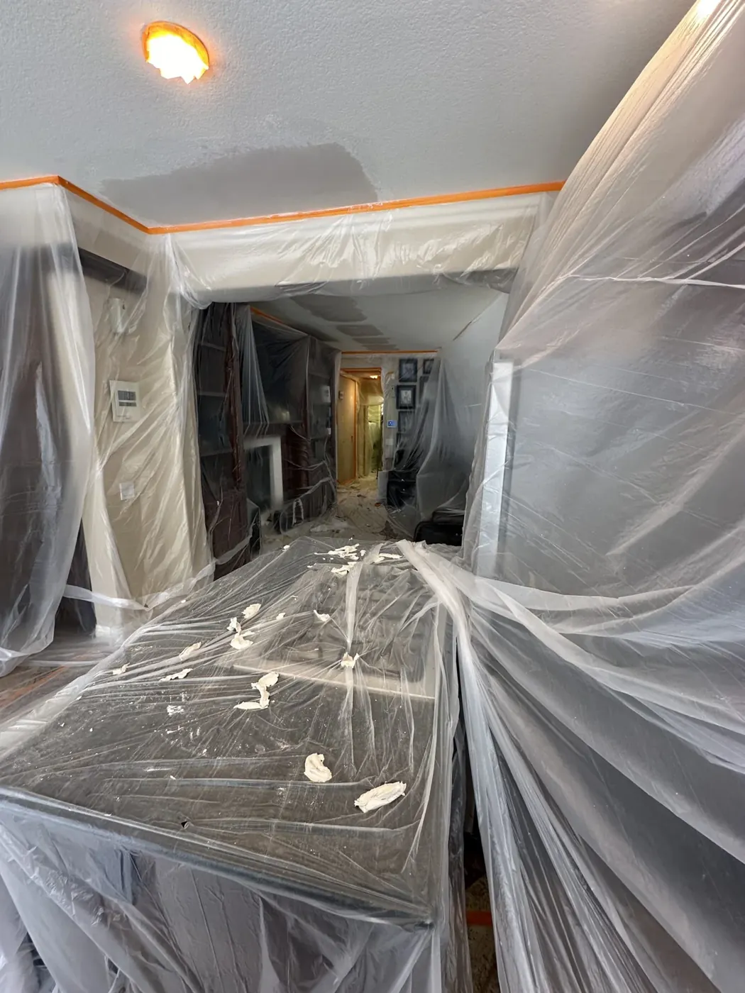 Protective sheeting covering a room during plumbing work